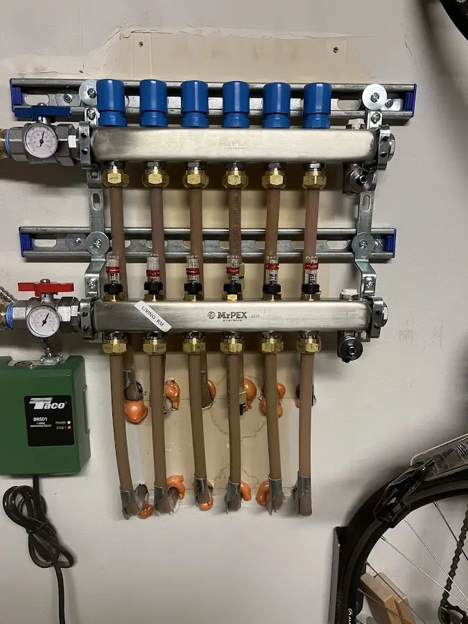 Plumber performing Water Heater Repair at a residential property in Okauchee Lake